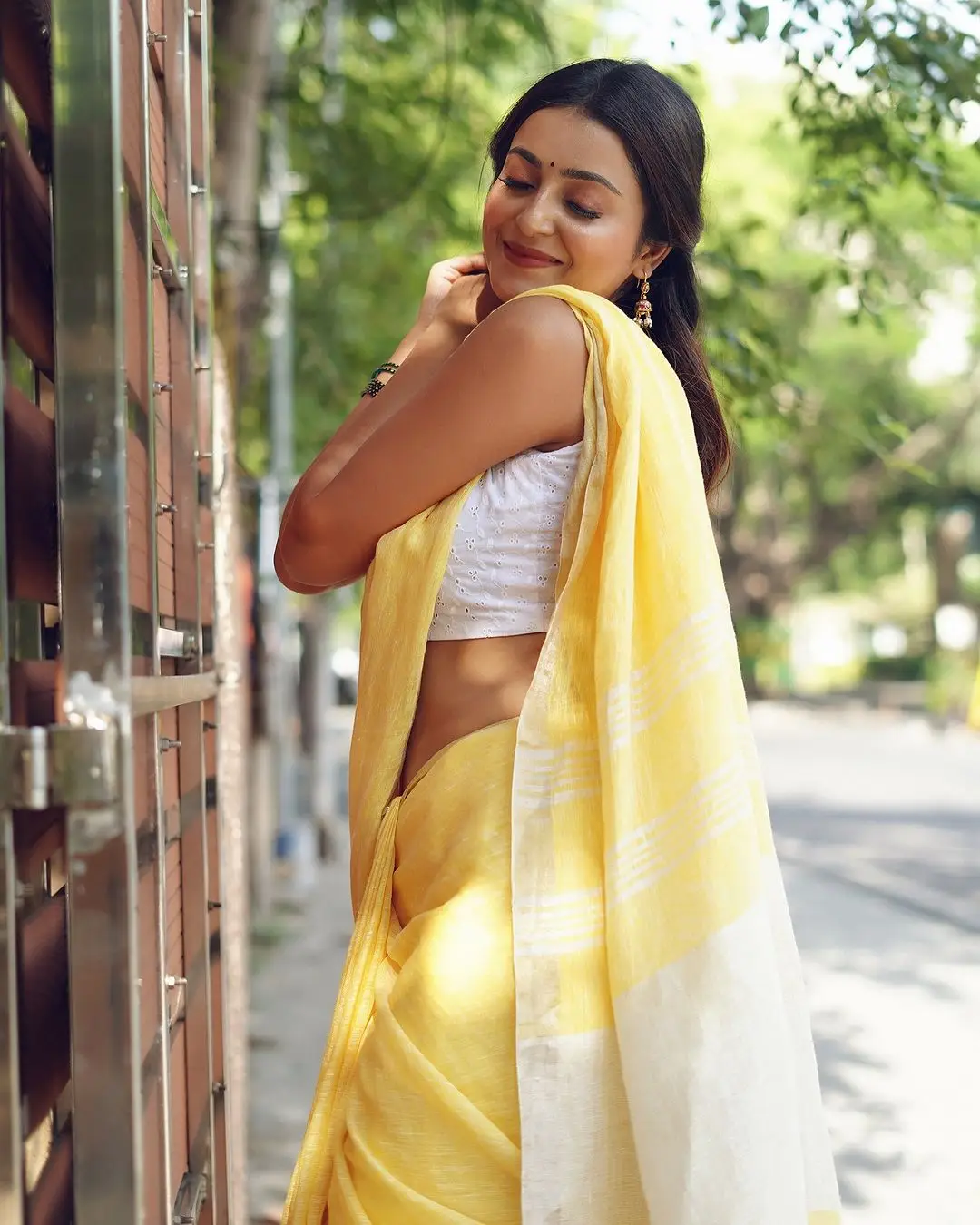 Avantika Mishra Stills in Yellow Saree White Sleeveless Blouse